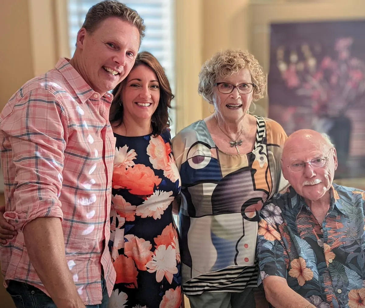 Chad and Liz with his parents, the 4 of them together indoors.