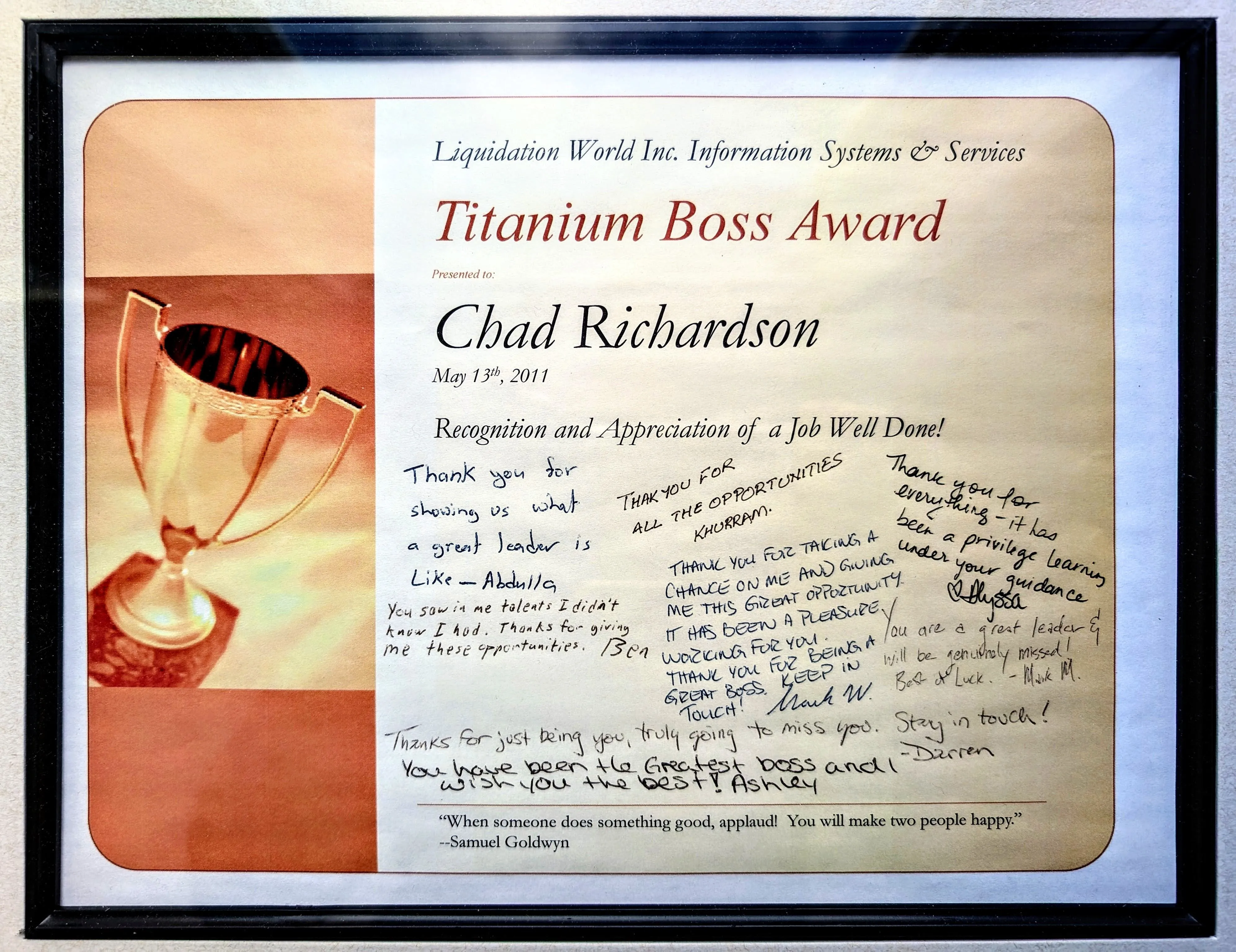 A framed Titanium Boss Award presented to Chad Richardson, covered in handwritten thank-you notes from his team.