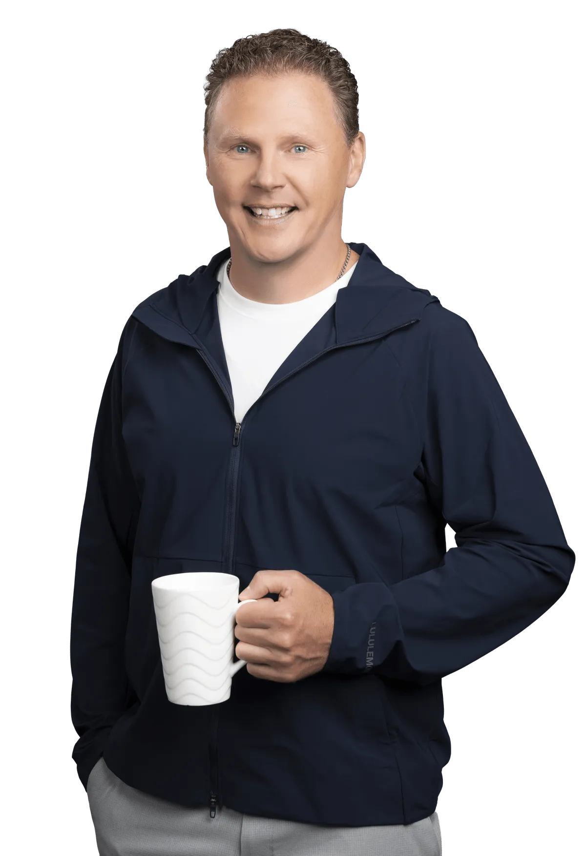 Chad Richardson standing with a coffee mug, smiling at the camera.
